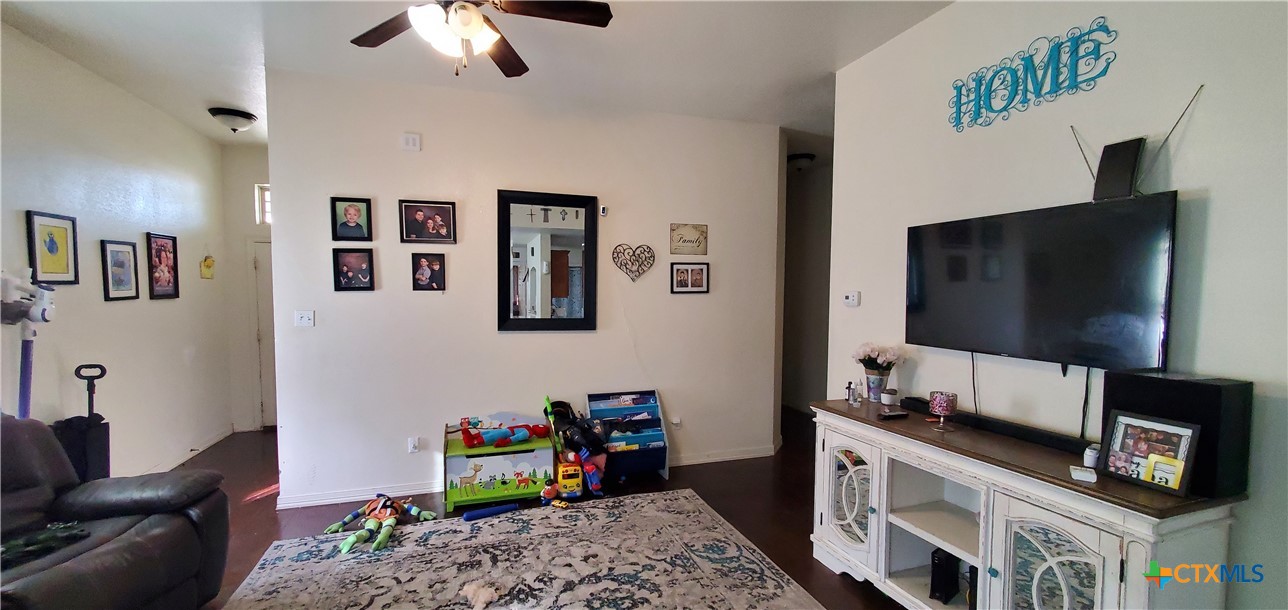 2201 Valley Forge Avenue Temple, TX 76504 - Photo 7 of 15 a living room with furniture and a flat screen tv