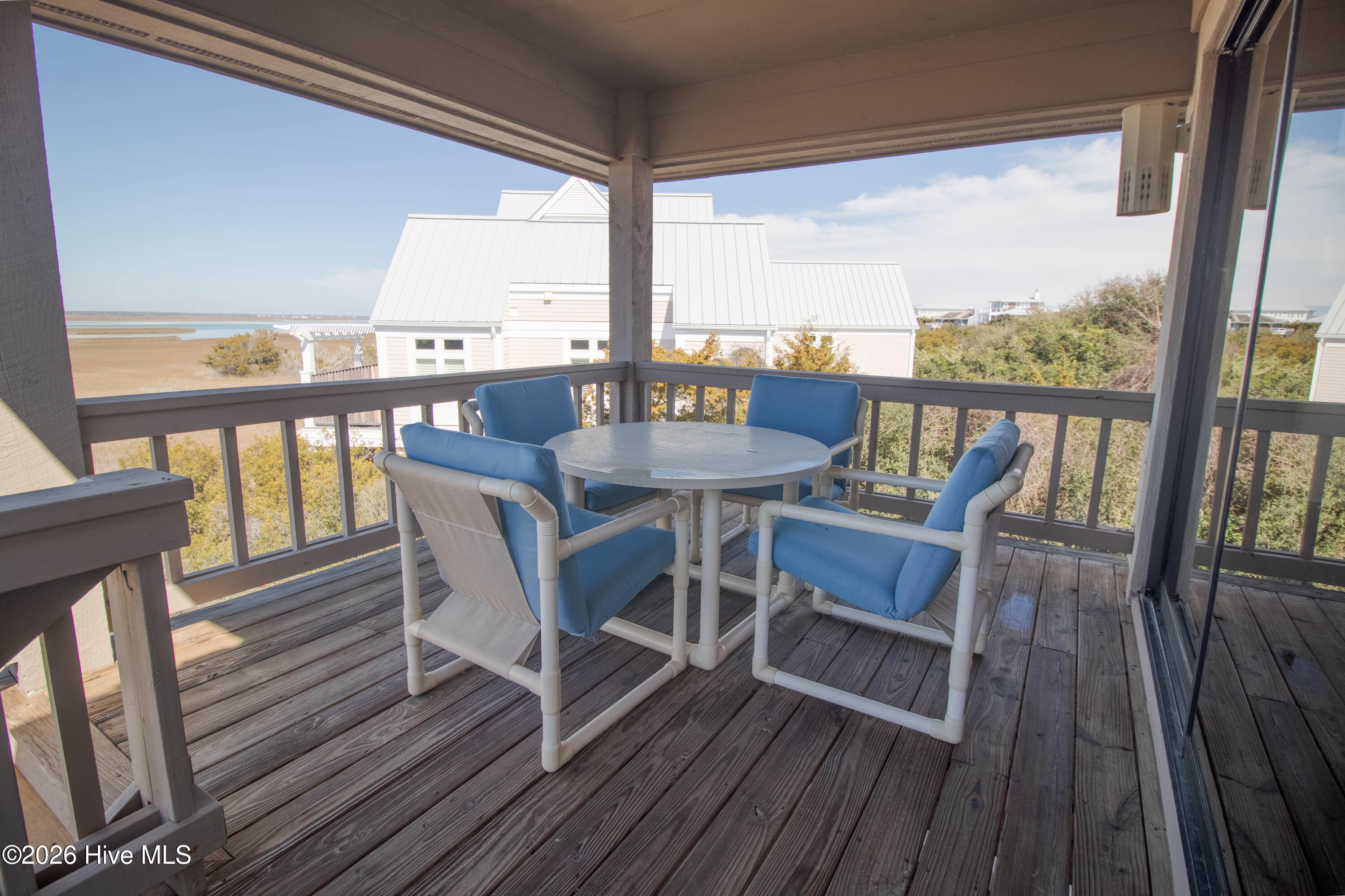 403 Beach Road North Wilmington, NC 28411 - Photo 11 of 26 Covered porch directly off the kitchen perfect for entertaining.