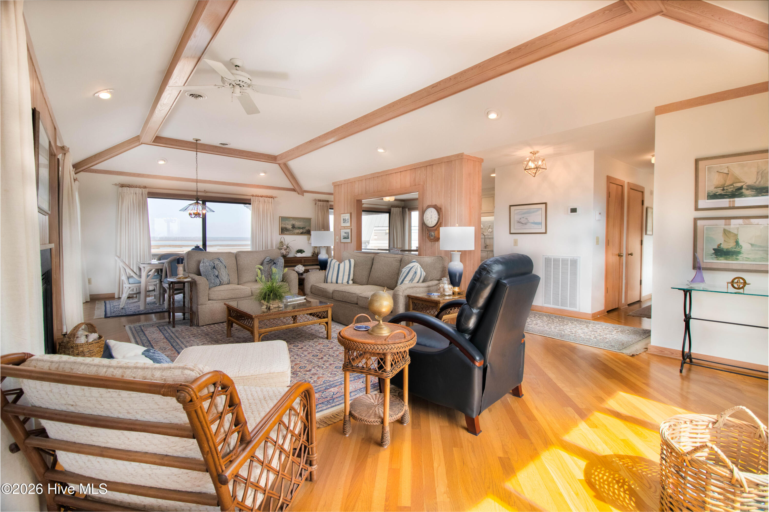 403 Beach Road North Wilmington, NC 28411 - Photo 4 of 26 Large windows throughout the living area.
