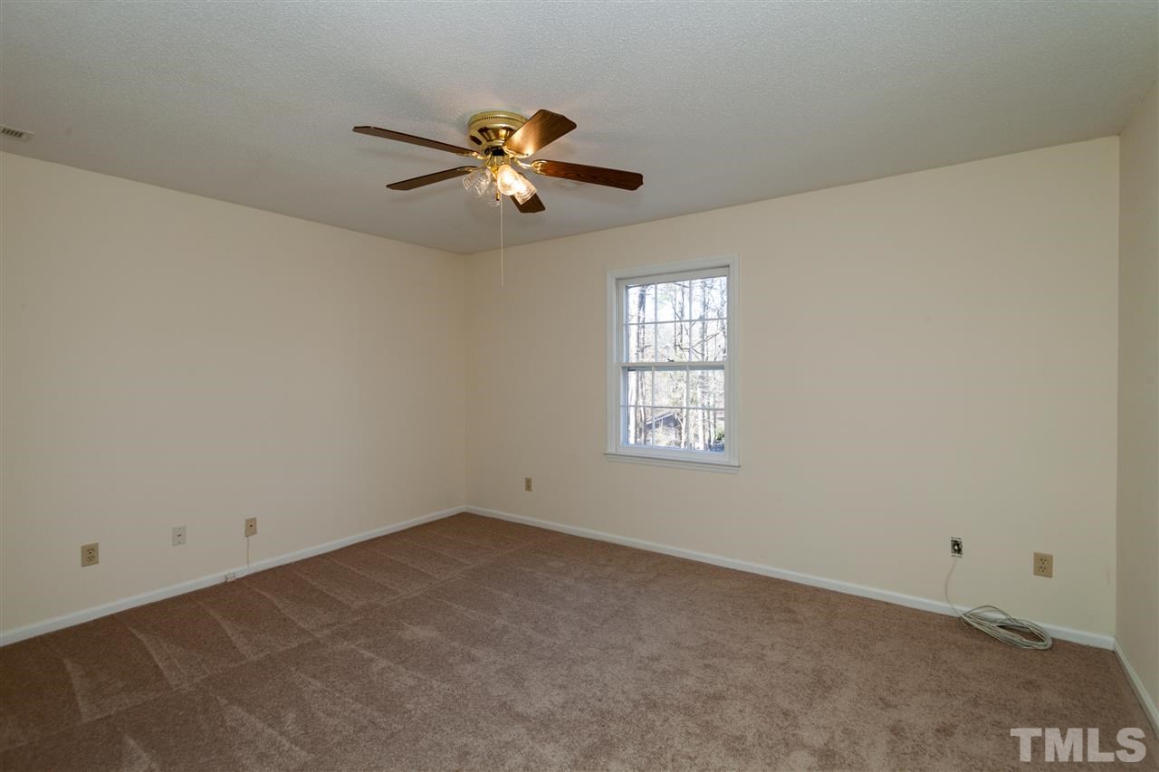 5827 Russell Road Durham, NC 27712 - Photo 15 of 25 an empty room with windows and fan