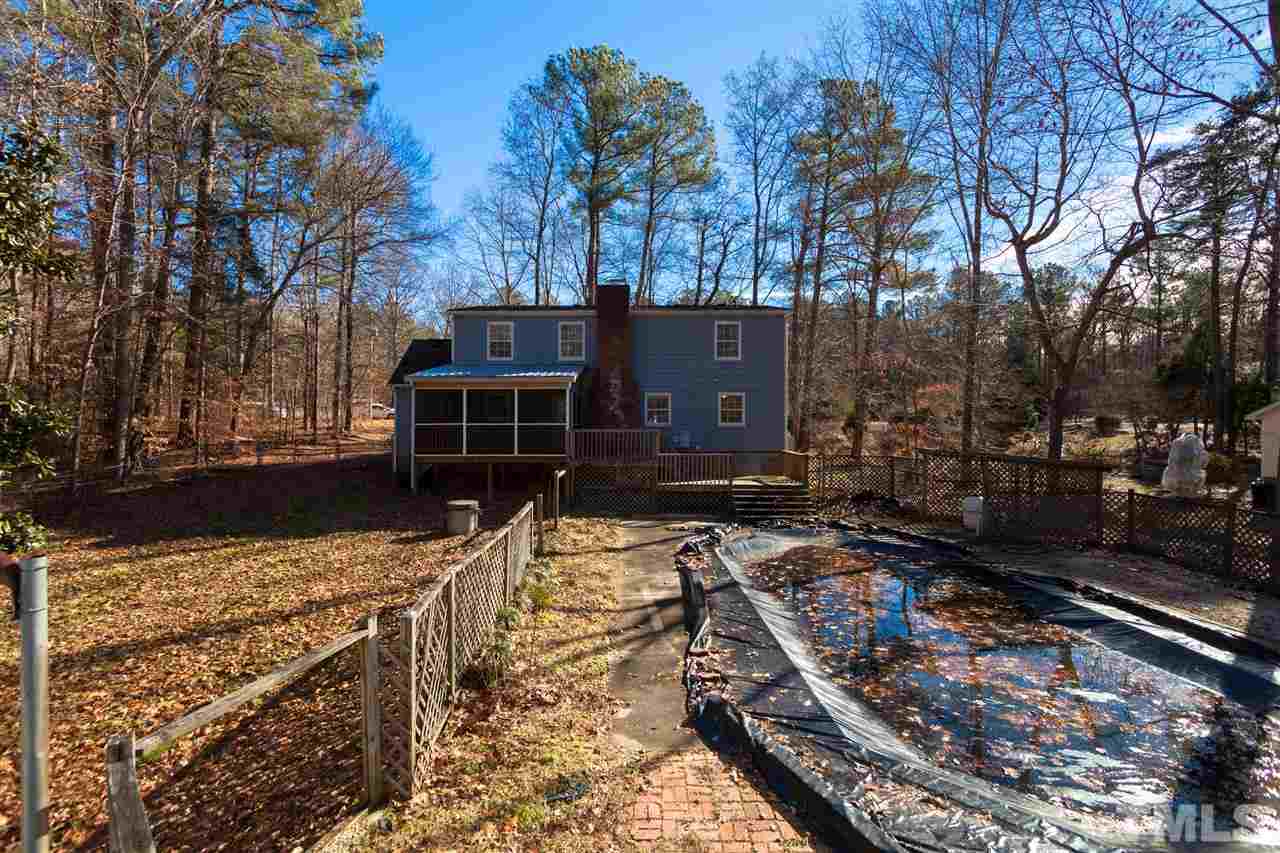 5827 Russell Road Durham, NC 27712 - Photo 23 of 25 a view of a house with a yard