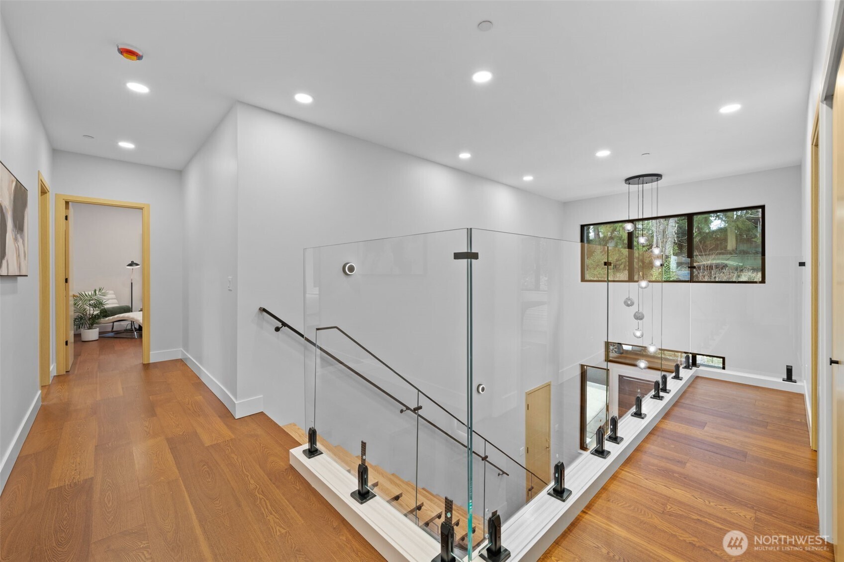 7903 240th Street Southwest Edmonds, WA 98026 - Photo 13 of 35 a view of a hallway with wooden floor and stairs