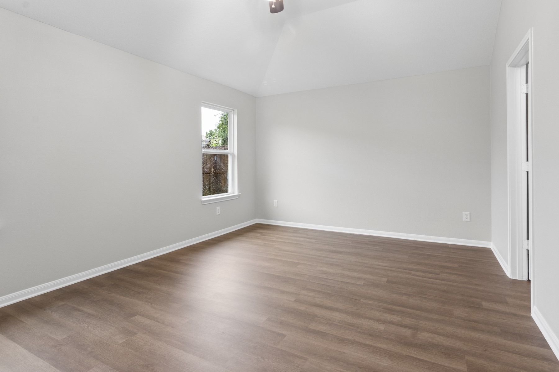 7811 Adonis Avenue Baytown, TX 77521 - Photo 25 of 36 a view of wooden floor and windows in a room