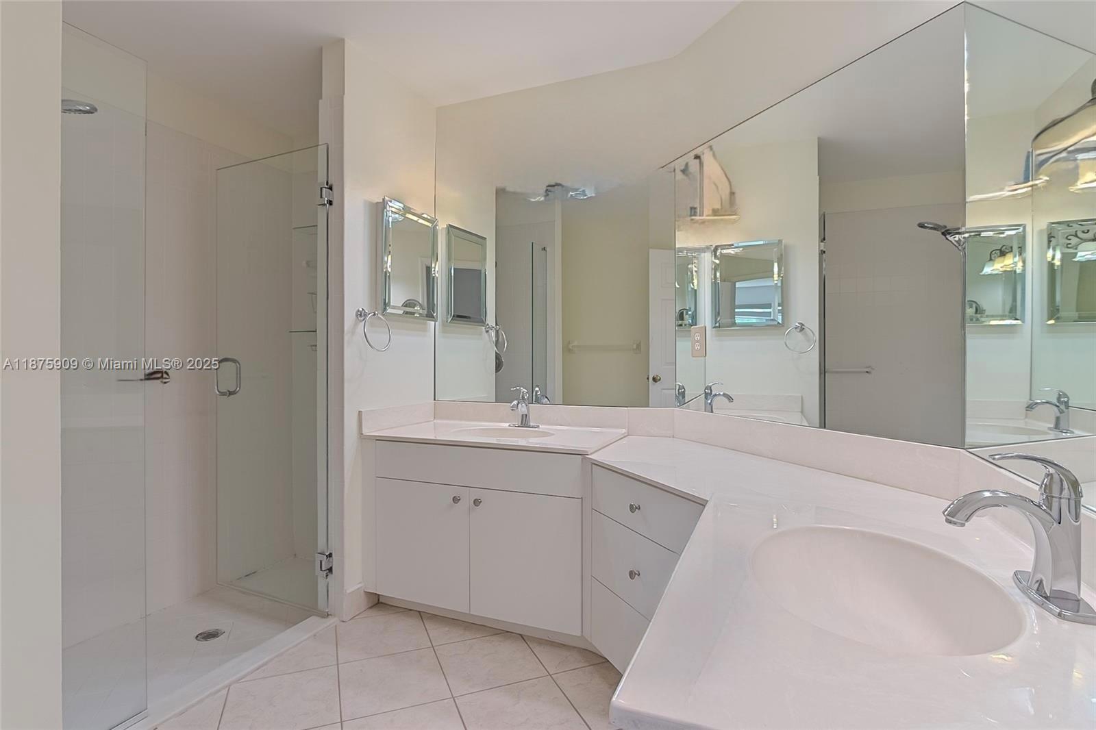 8658 Vía Reale, Unit 3 Boca Raton, FL 33496 - Photo 15 of 39 a spacious bathroom with a bathtub sink and mirror