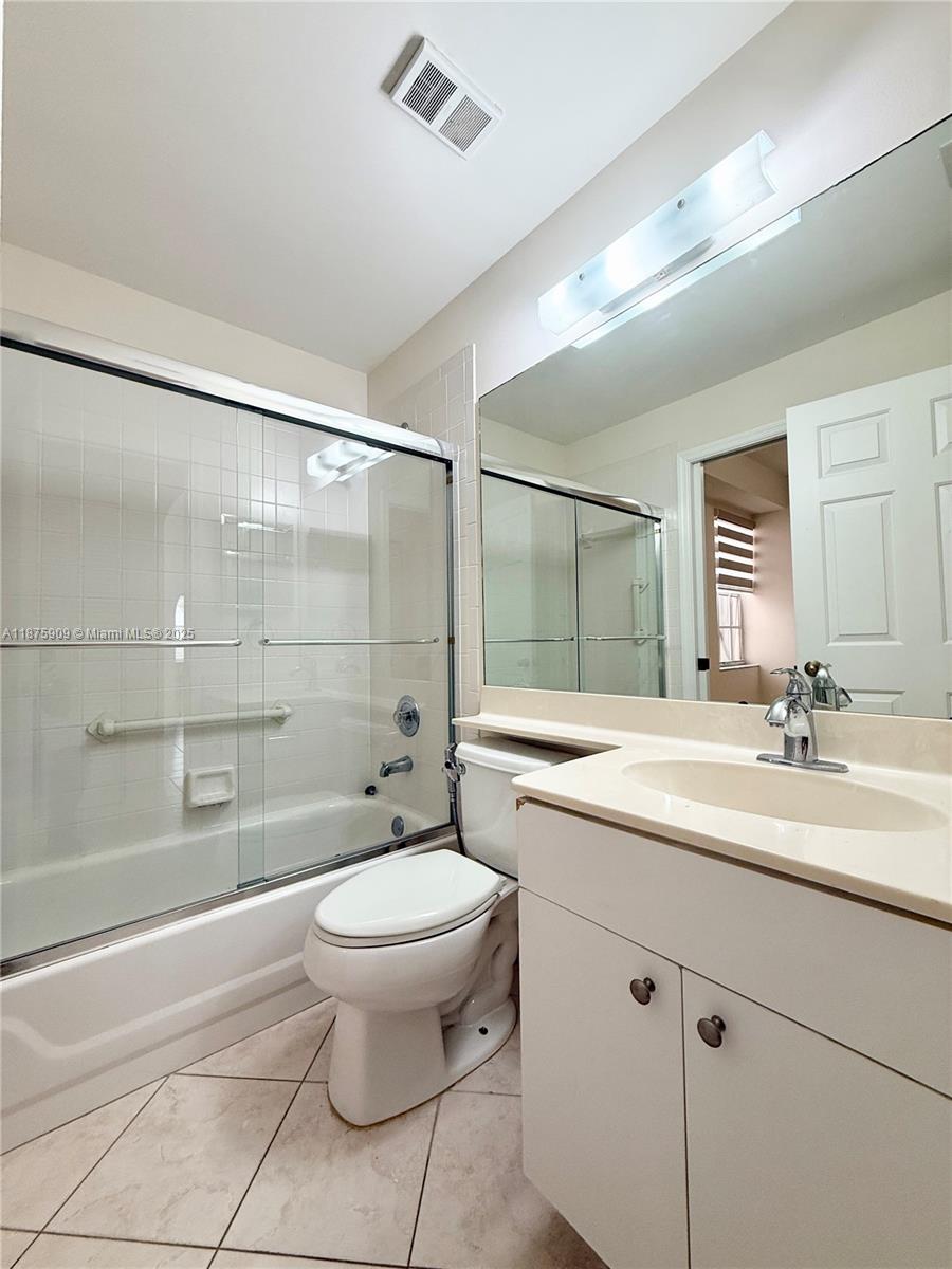 8658 Vía Reale, Unit 3 Boca Raton, FL 33496 - Photo 18 of 39 a bathroom with a sink toilet and shower