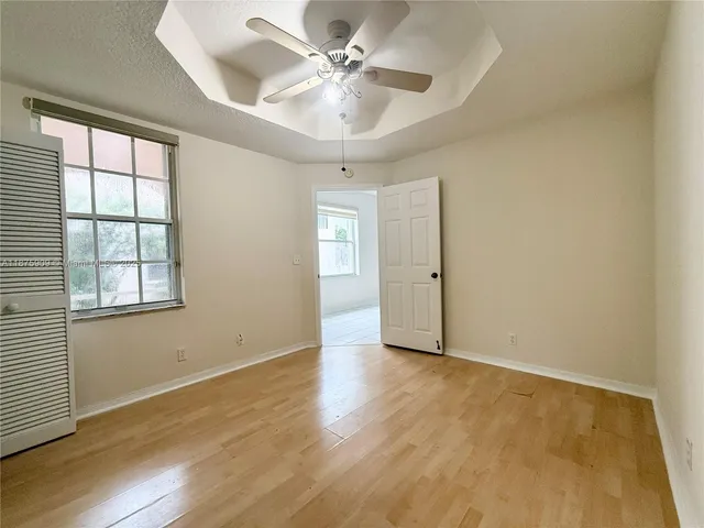 a view of a porch with wooden floor and outdoor space