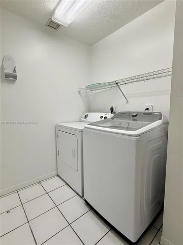 a utility room with cabinets