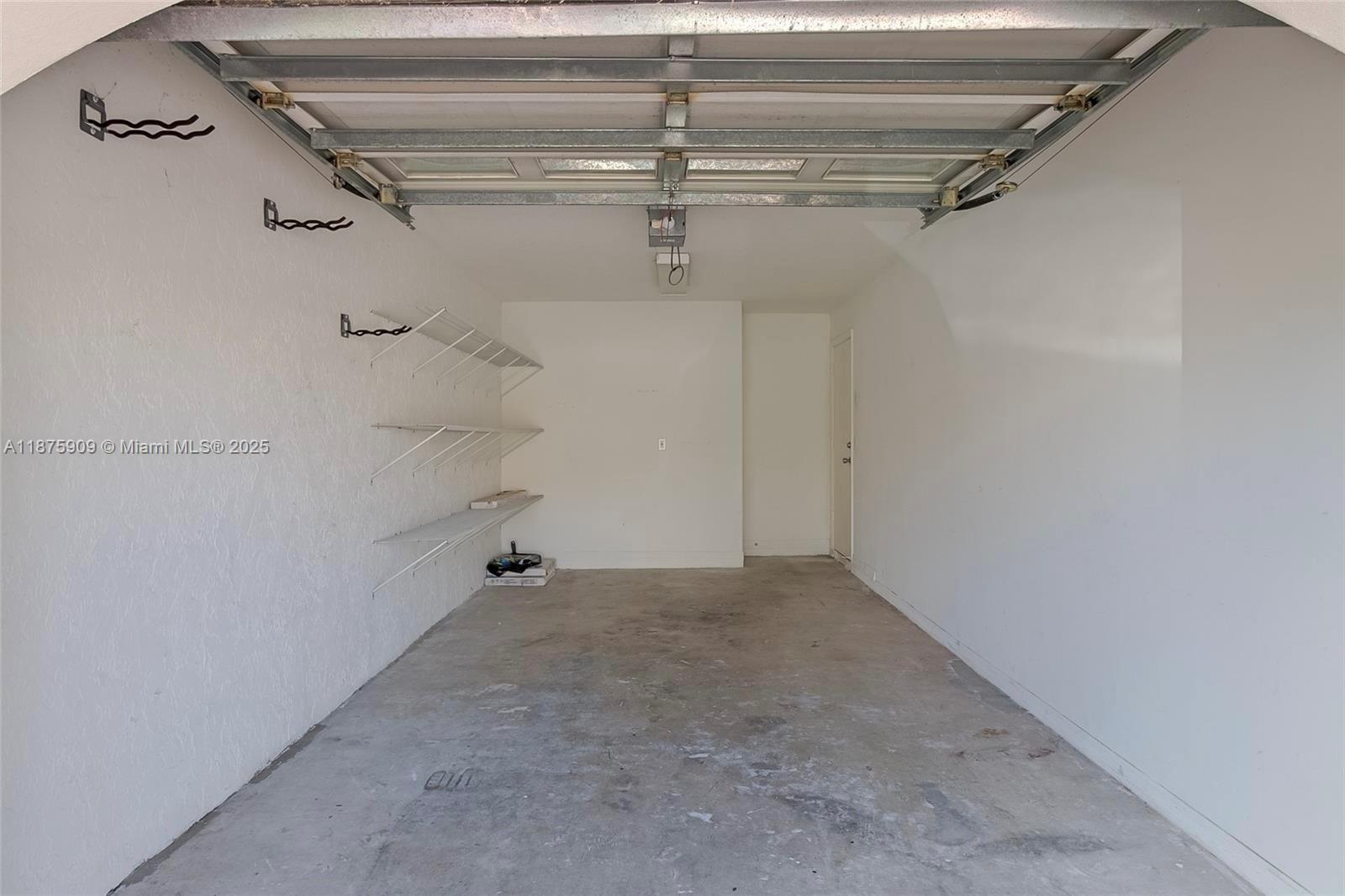 8658 Vía Reale, Unit 3 Boca Raton, FL 33496 - Photo 26 of 39 a view of a room with racks on the wall