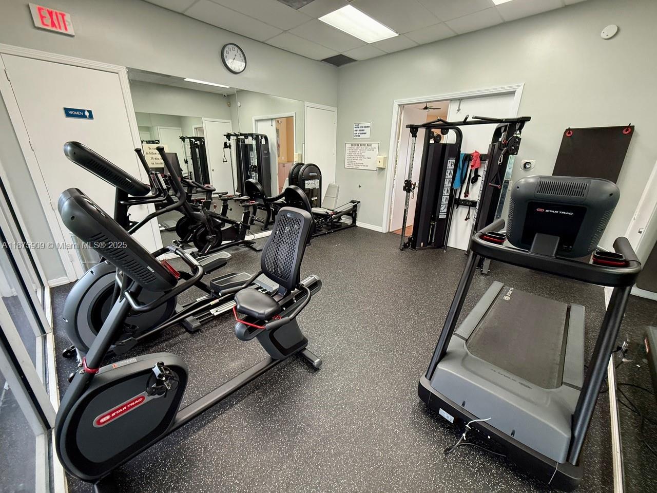 8658 Vía Reale, Unit 3 Boca Raton, FL 33496 - Photo 29 of 39 a view of a room with gym equipment