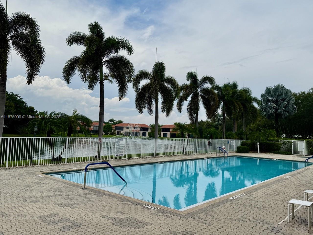 8658 Vía Reale, Unit 3 Boca Raton, FL 33496 - Photo 30 of 39 a view of swimming pool with a lounge chair