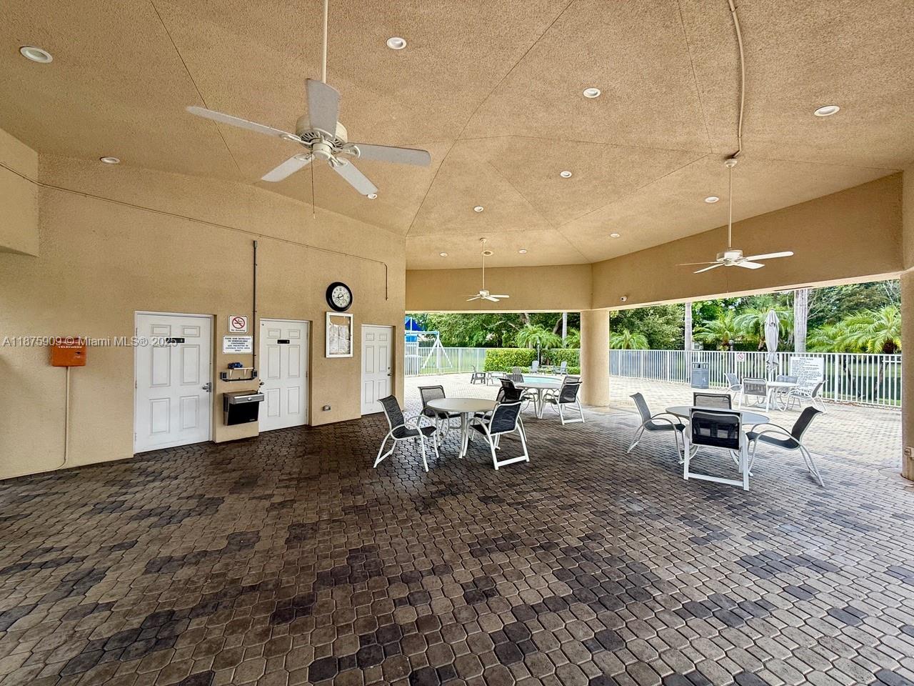 8658 Vía Reale, Unit 3 Boca Raton, FL 33496 - Photo 32 of 39 a view of a dining room with furniture window and outside view
