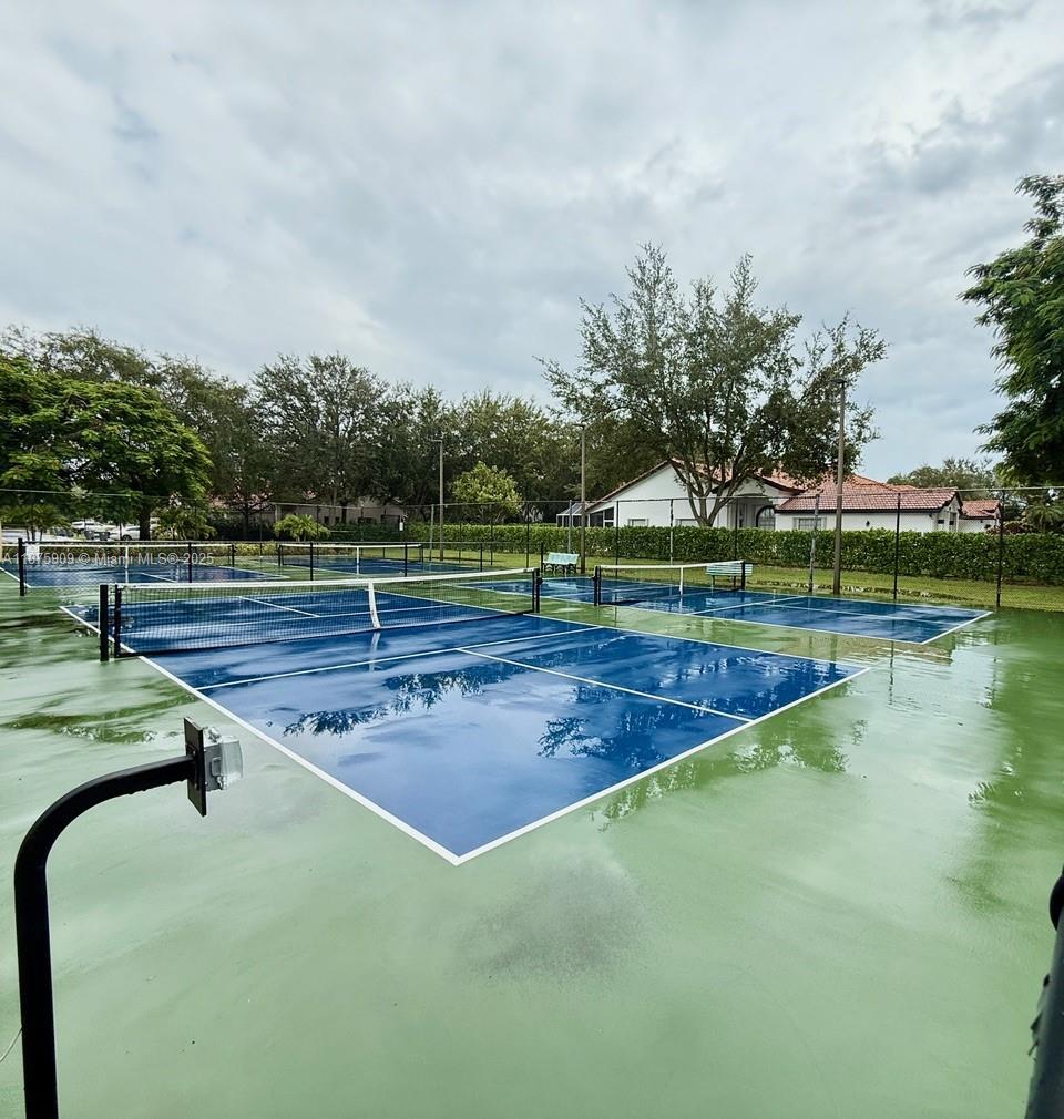 8658 Vía Reale, Unit 3 Boca Raton, FL 33496 - Photo 37 of 39 a view of a tennis court