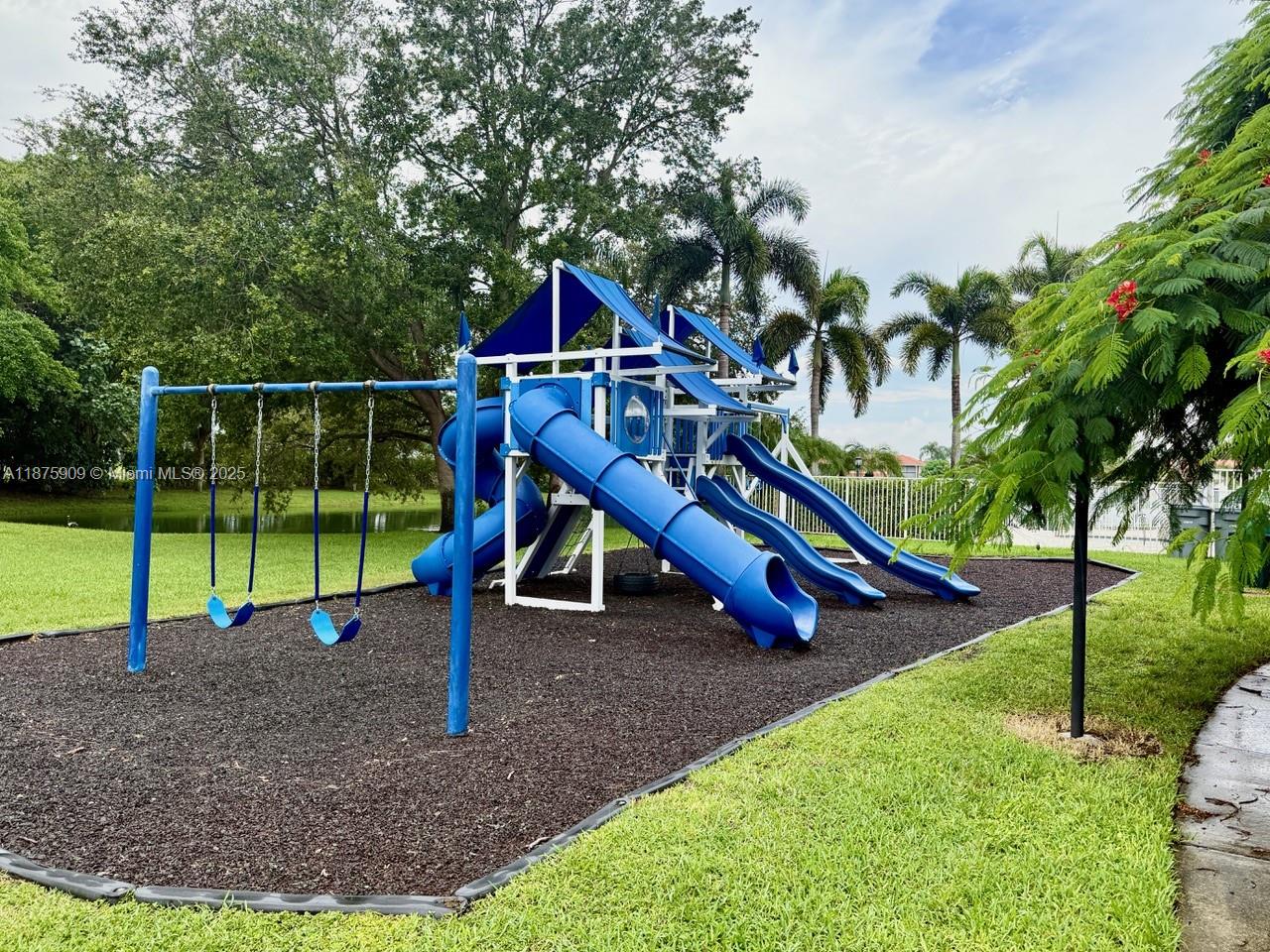 8658 Vía Reale, Unit 3 Boca Raton, FL 33496 - Photo 38 of 39 a view of a park with slide