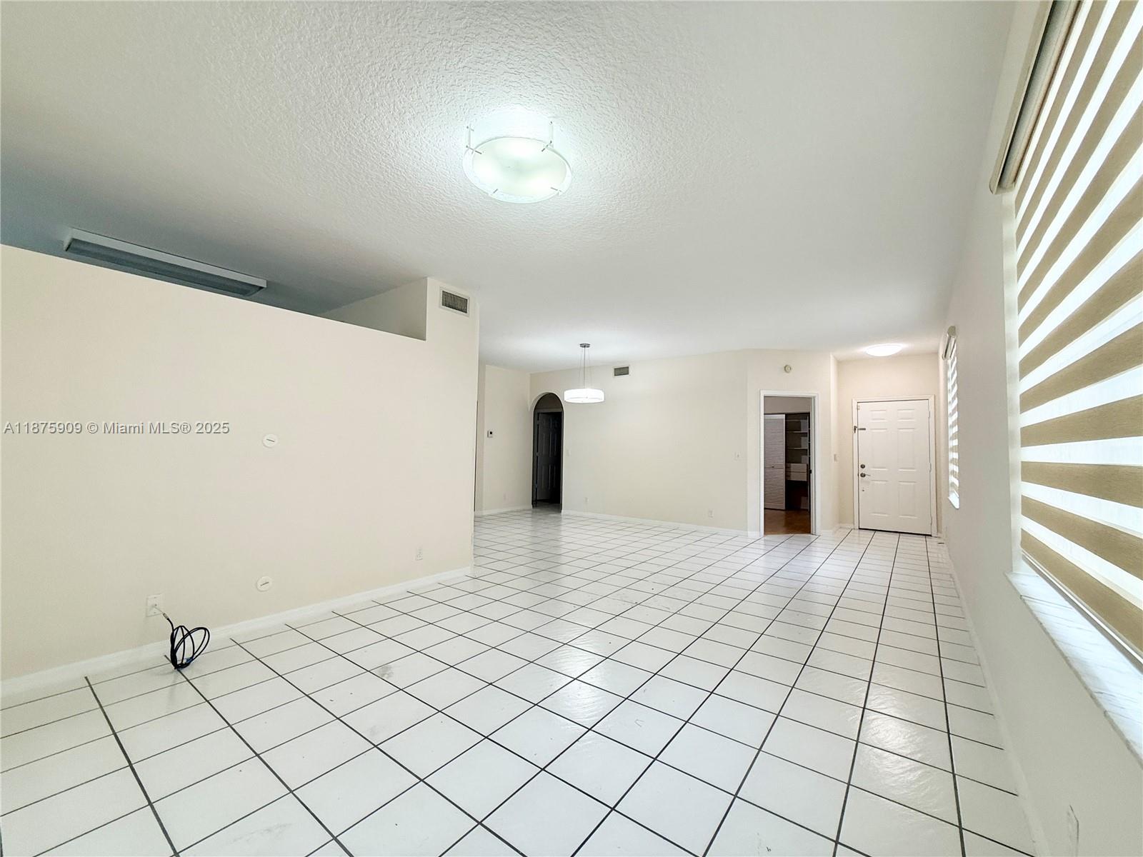 8658 Vía Reale, Unit 3 Boca Raton, FL 33496 - Photo 4 of 39 a view of an empty room and window