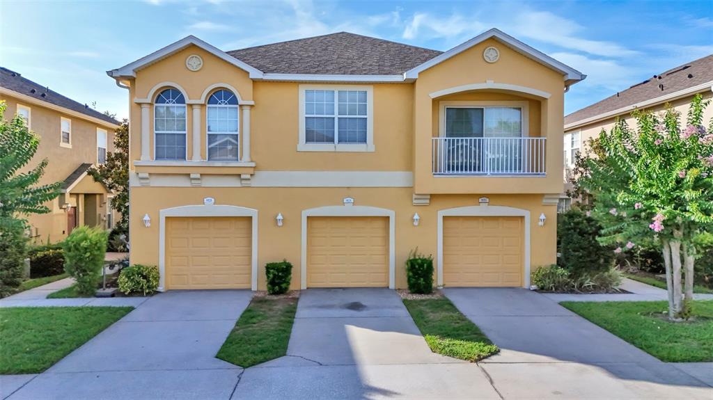 8828 Moonlit Meadows Loop Riverview, FL 33578 - Photo 1 of 1 a front view of a house with a yard and garage