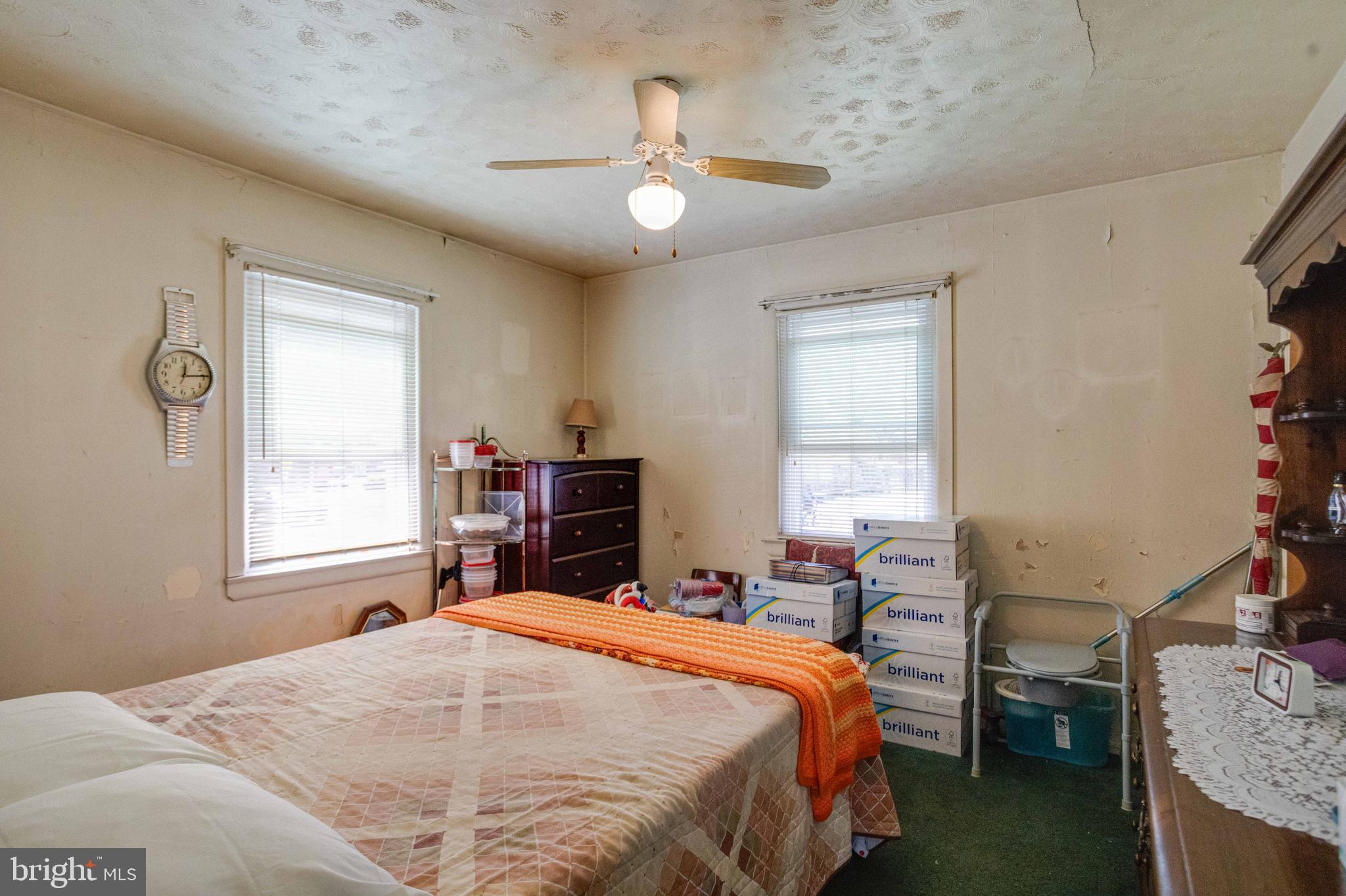 900 Renfrew Street Baltimore, MD 21221 - Photo 17 of 40 a bedroom with a bed and a window