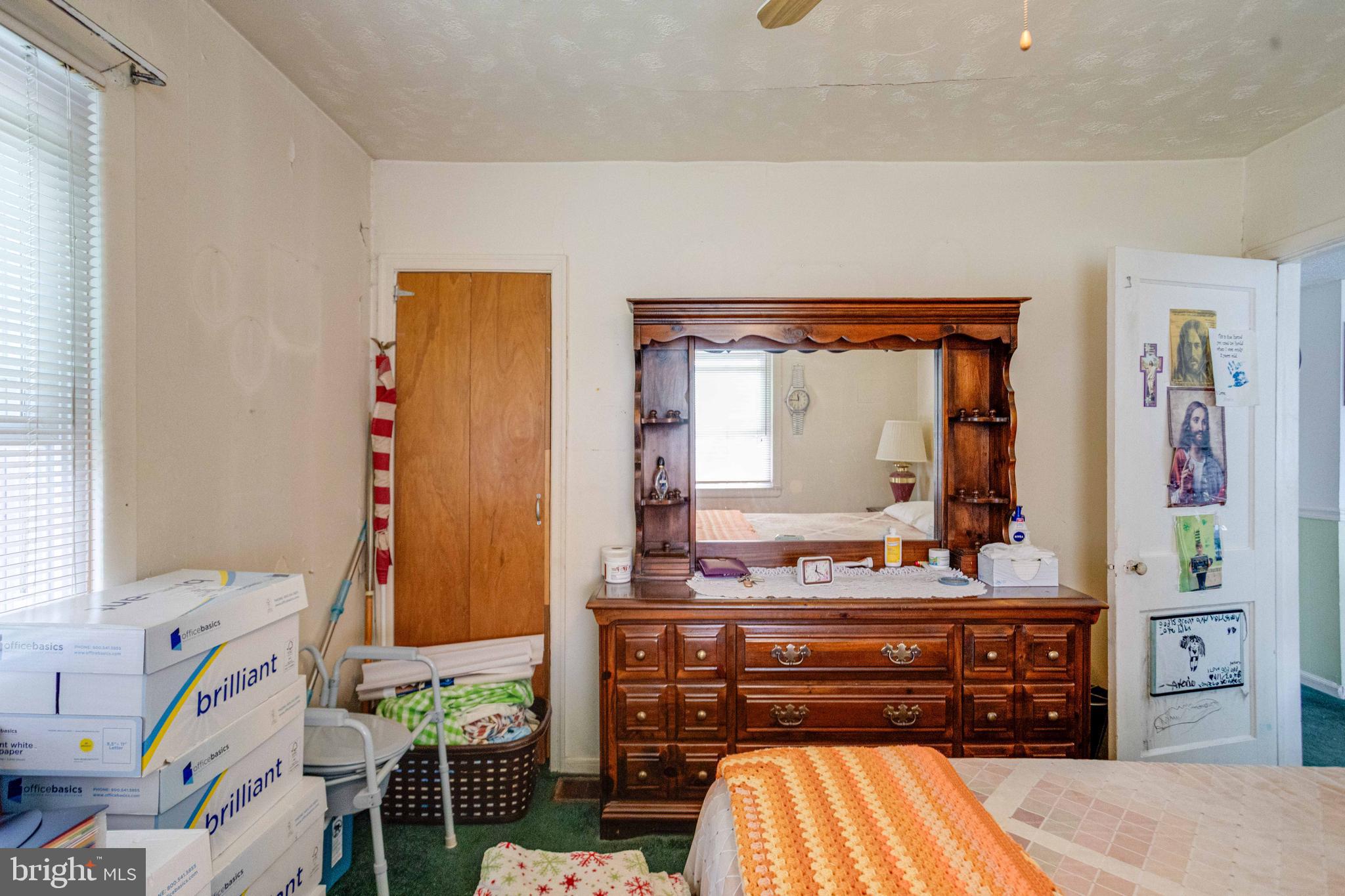 900 Renfrew Street Baltimore, MD 21221 - Photo 20 of 40 a room with a bed and a dresser in it
