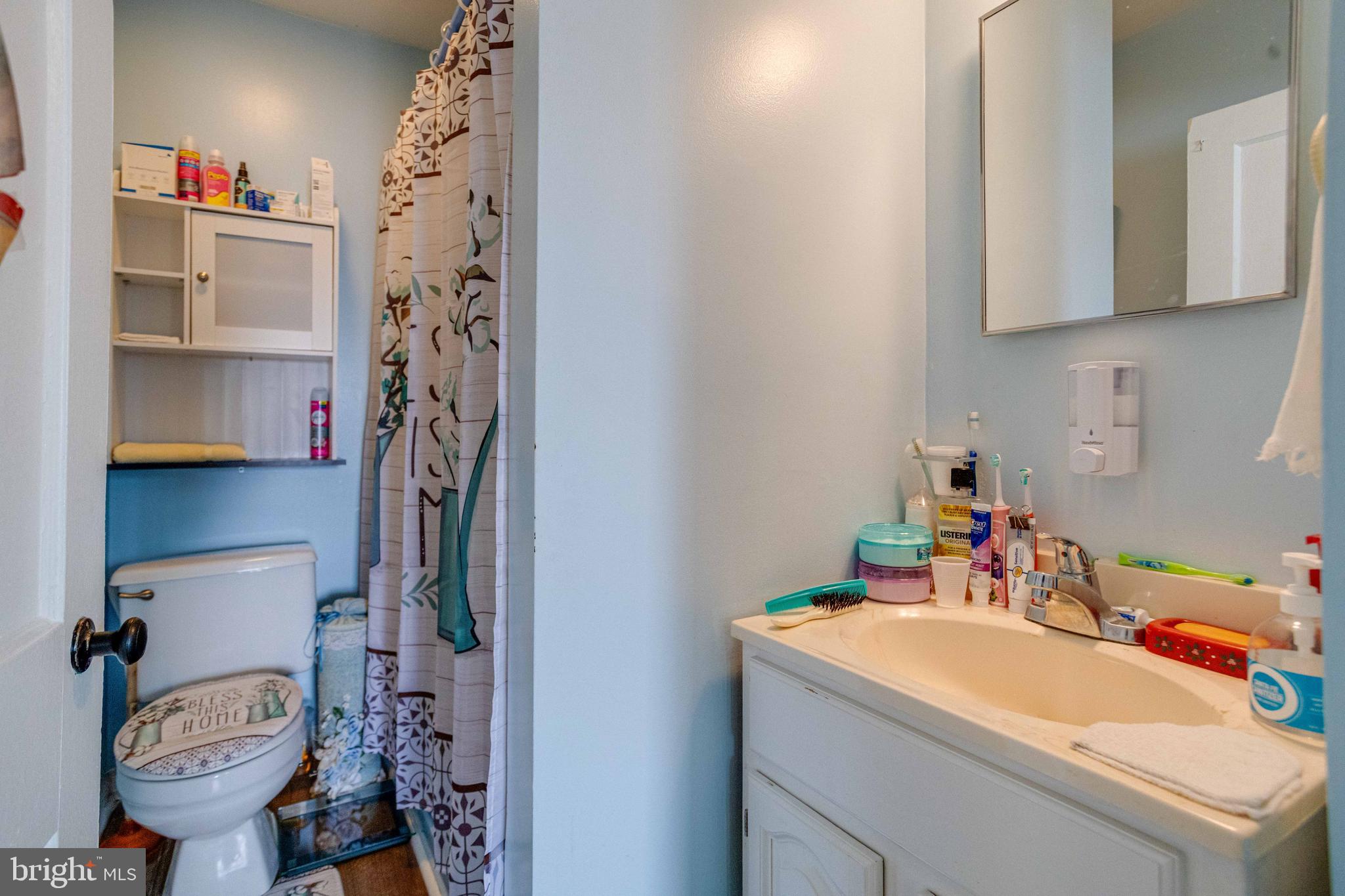 900 Renfrew Street Baltimore, MD 21221 - Photo 26 of 40 a bathroom with a sink toilet and shower