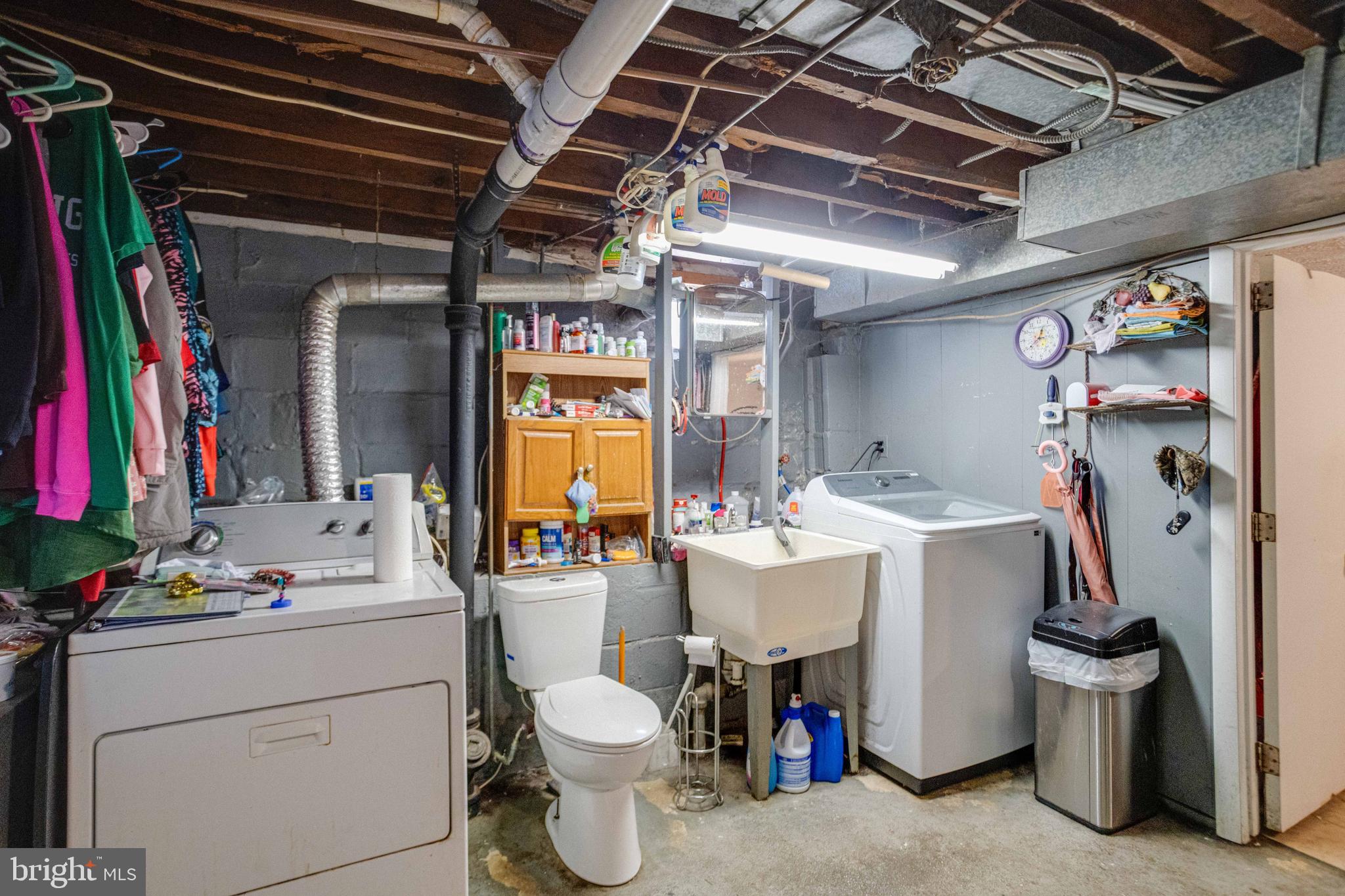 900 Renfrew Street Baltimore, MD 21221 - Photo 29 of 40 a bathroom with a sink and a mirror