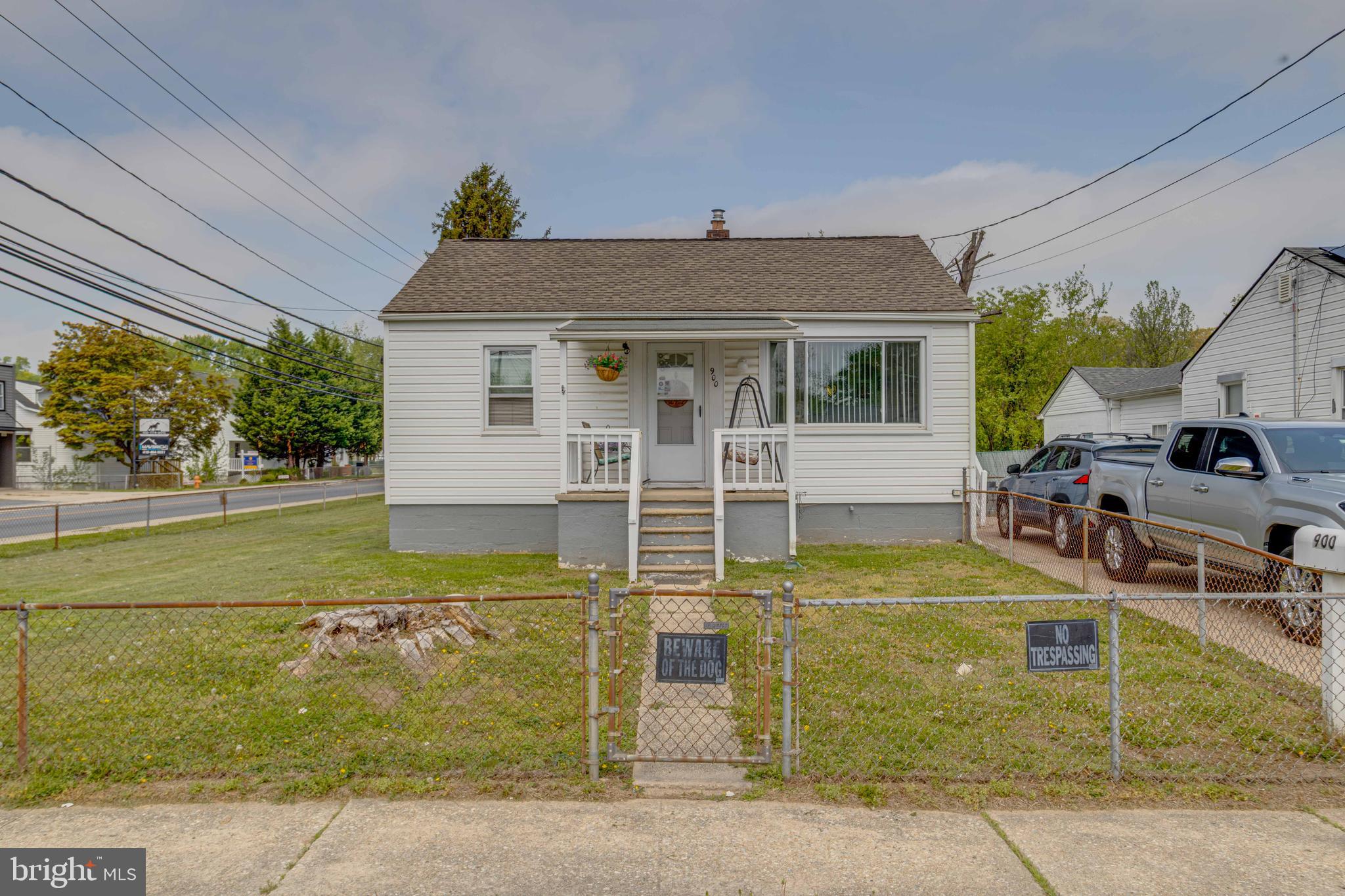 900 Renfrew Street Baltimore, MD 21221 - Photo 3 of 40 a view of a house with a backyard