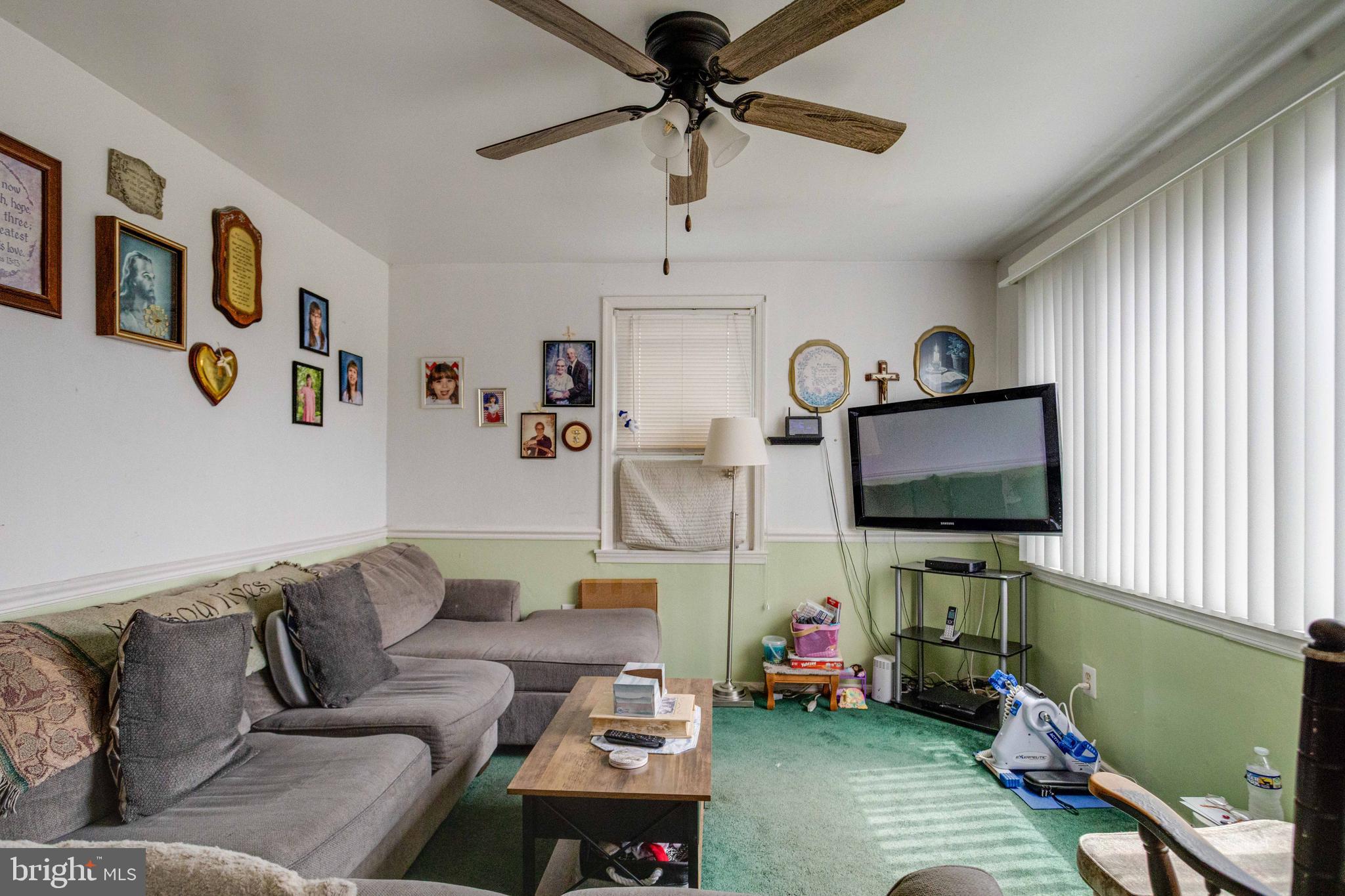 900 Renfrew Street Baltimore, MD 21221 - Photo 6 of 40 a living room with furniture and a flat screen tv