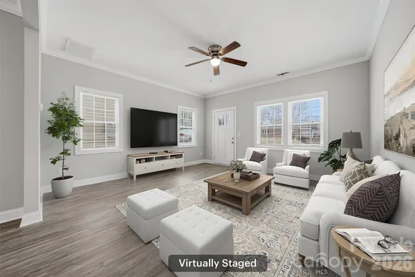 a living room with furniture and a flat screen tv