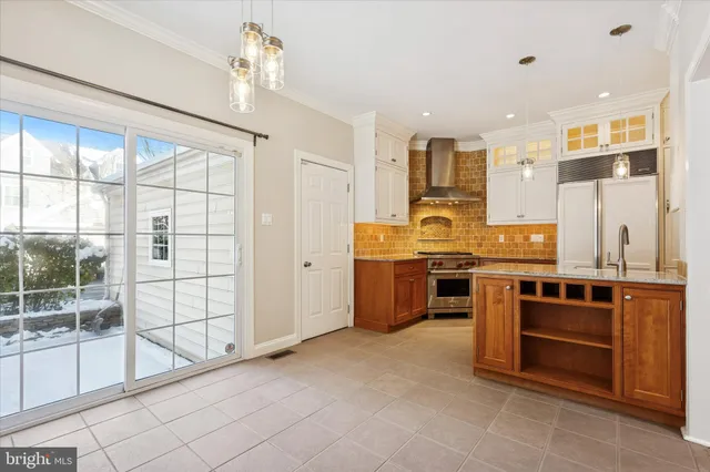 a kitchen with stainless steel appliances granite countertop a stove and a sink