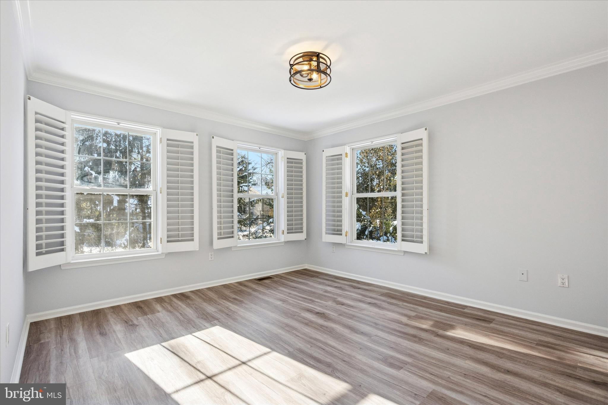 6 Edison Lane Doylestown, PA 18901 - Photo 18 of 41 a view of an empty room with wooden floor and a window