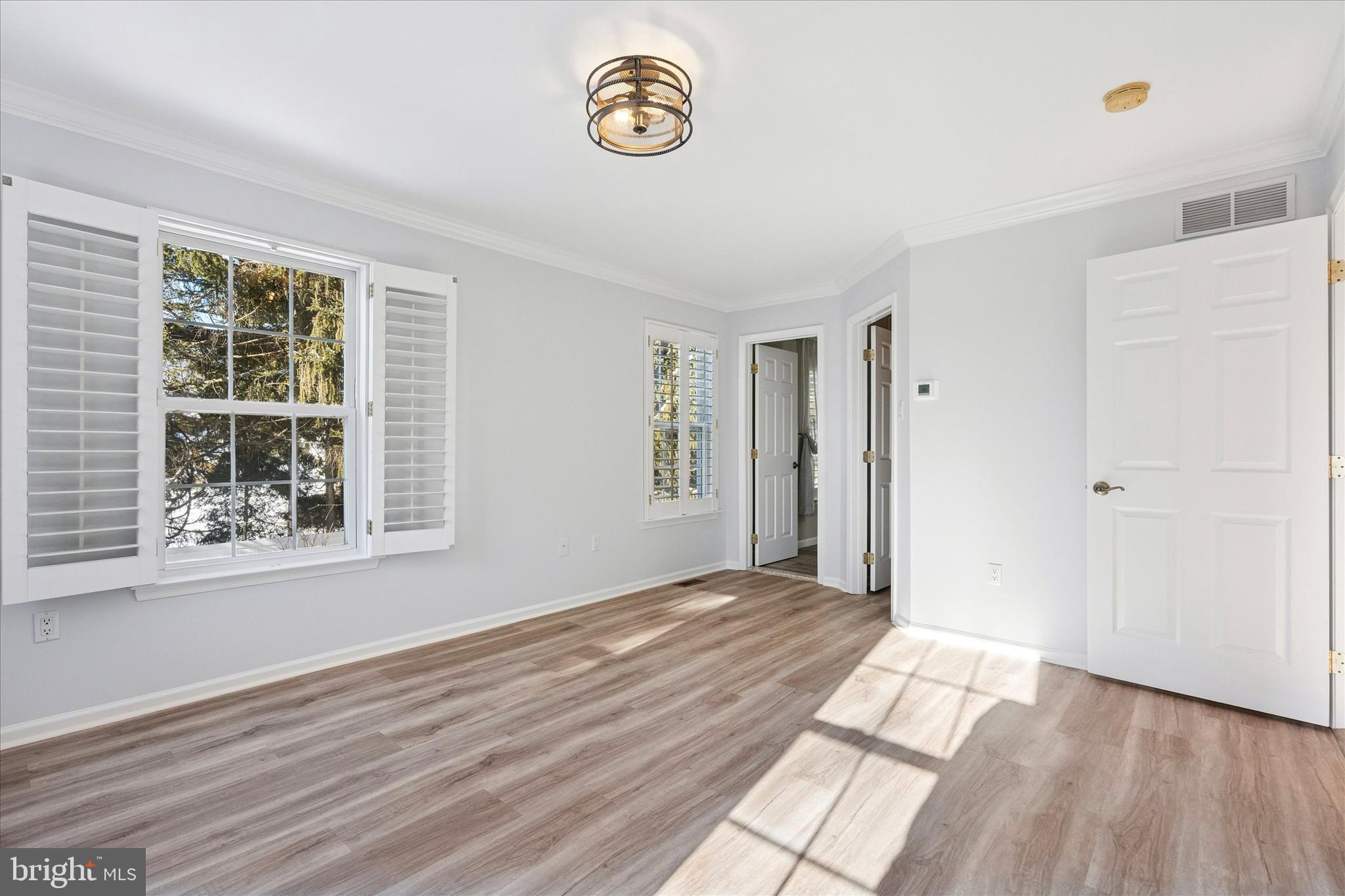 6 Edison Lane Doylestown, PA 18901 - Photo 19 of 41 a view of an empty room with wooden floor and a window