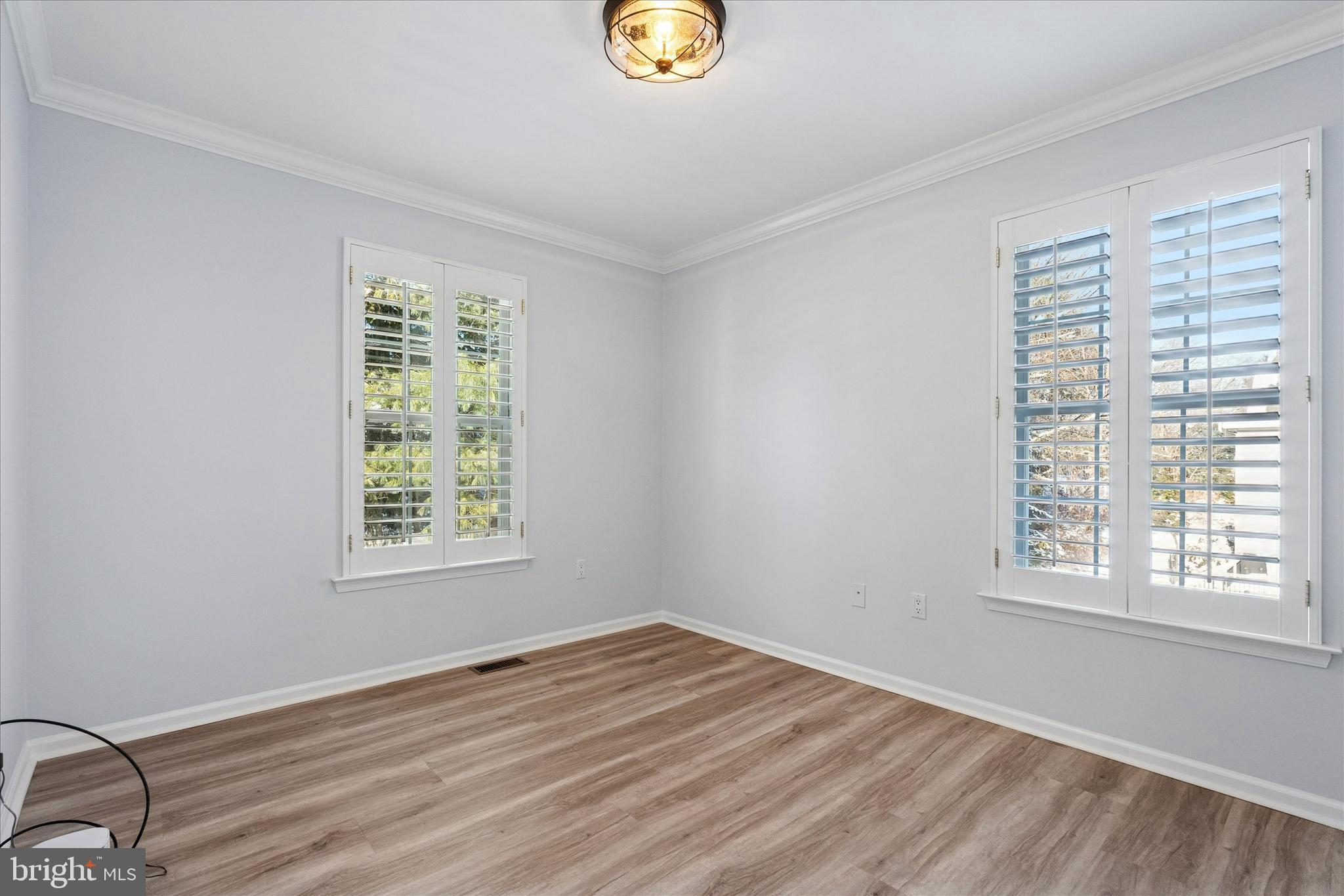 6 Edison Lane Doylestown, PA 18901 - Photo 22 of 41 a view of an empty room with window and wooden floor