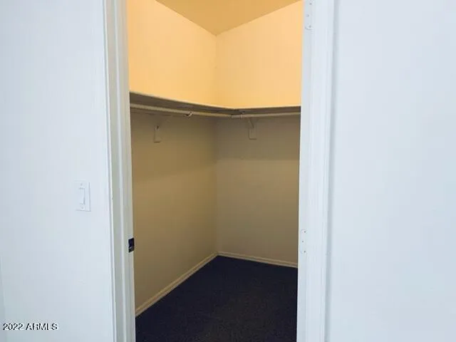 a view of a sink a mirror and a cabinets
