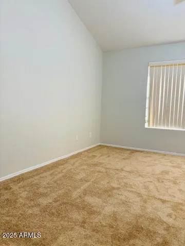 a view of an empty room and a window