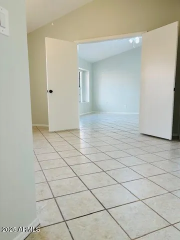 a view of a kitchen with kitchen island a sink a counter top space and cabinets