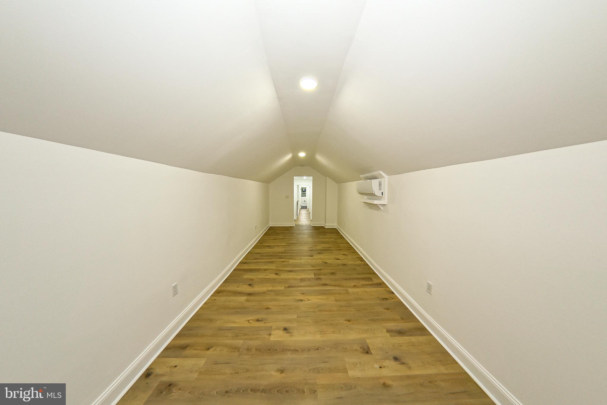 3704 Suitland Road Southeast Washington, DC 20020 - Photo 44 of 70 a view of a hallway with wooden floor