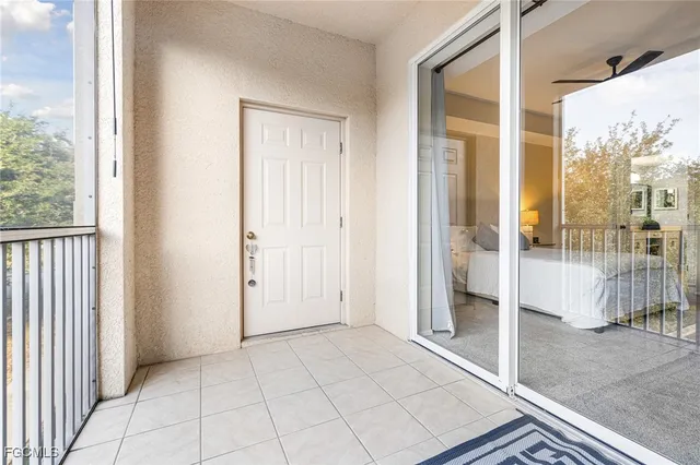 a very nice looking room with a large window and chandelier