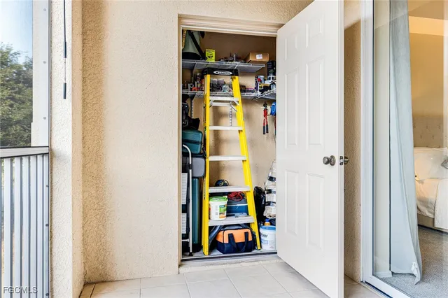 a spacious bedroom with a bed and large window