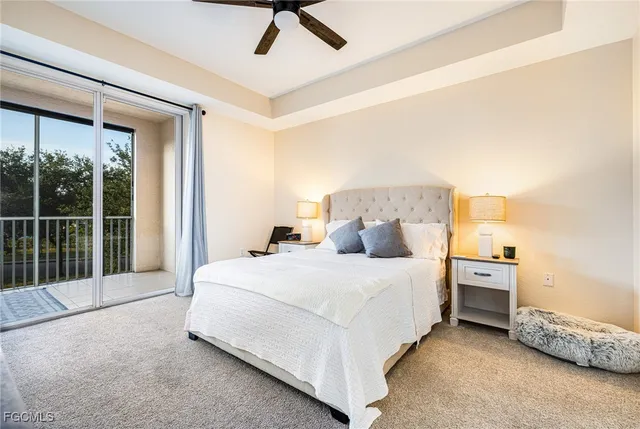 a large white bed in a white room