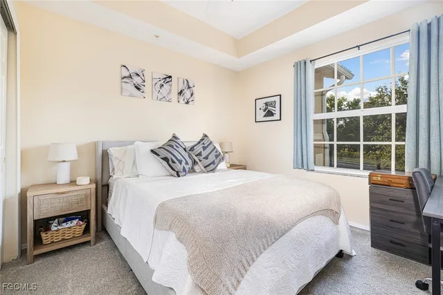 a bedroom with a bed and a table in it