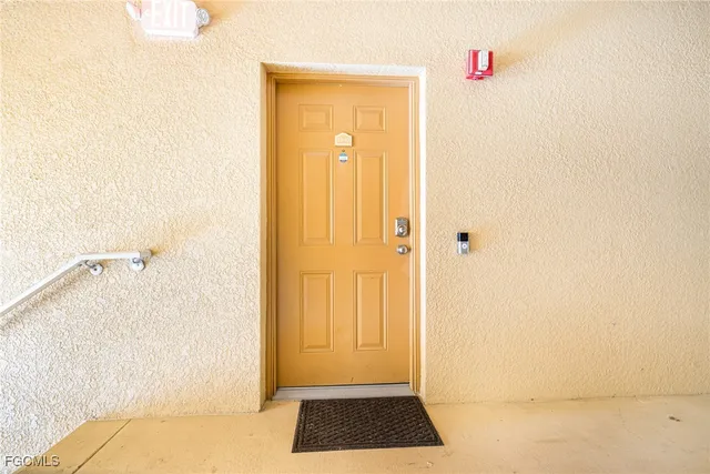 a kitchen with stainless steel appliances kitchen island granite countertop a refrigerator and microwave