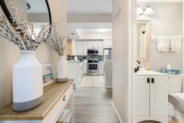 a kitchen with cabinets appliances and a sink