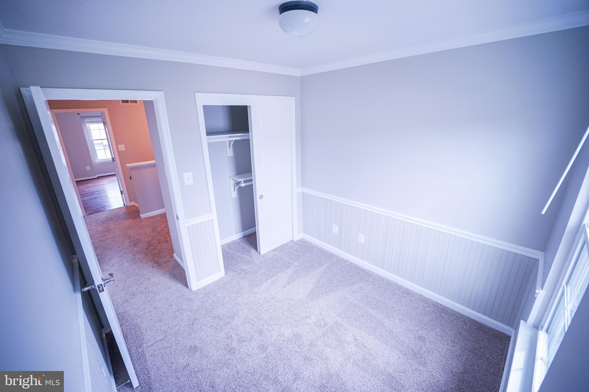 862 Vanderbilt Terrace Southeast Leesburg, VA 20175 - Photo 28 of 41 Bedroom 3 with crown molding and wainscoting