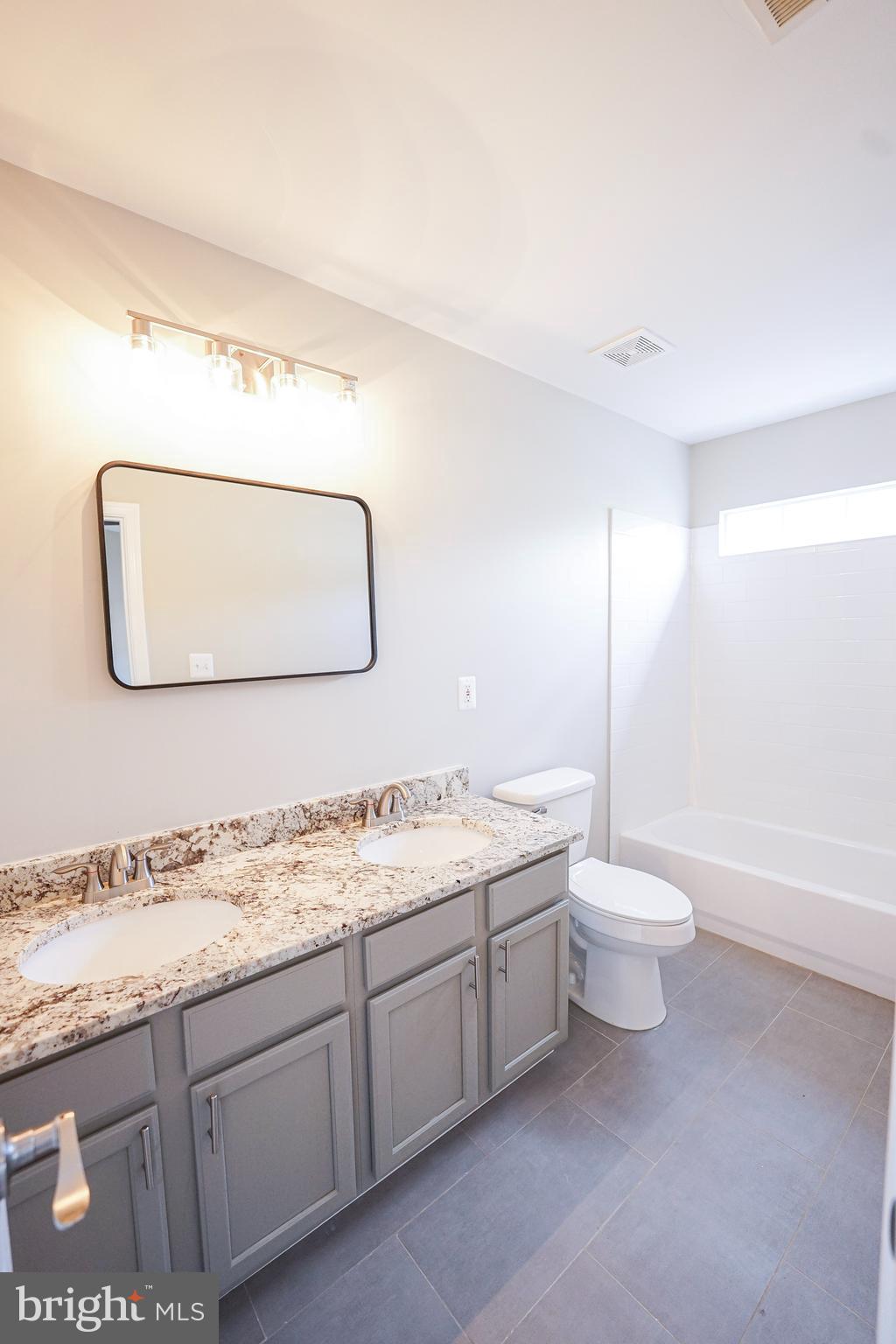 862 Vanderbilt Terrace Southeast Leesburg, VA 20175 - Photo 33 of 41 Completely remodeled his/hers Primary bathroom.