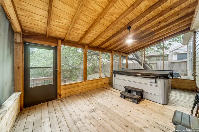 a room with wooden floor and furniture