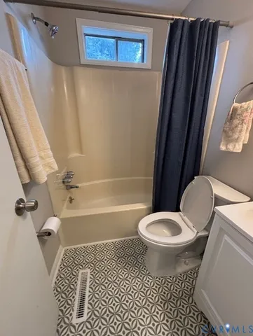 a bathroom with a toilet a sink and a shower