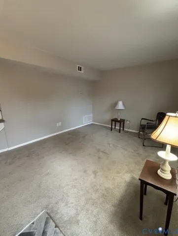 a view of a room with a sink and a chair