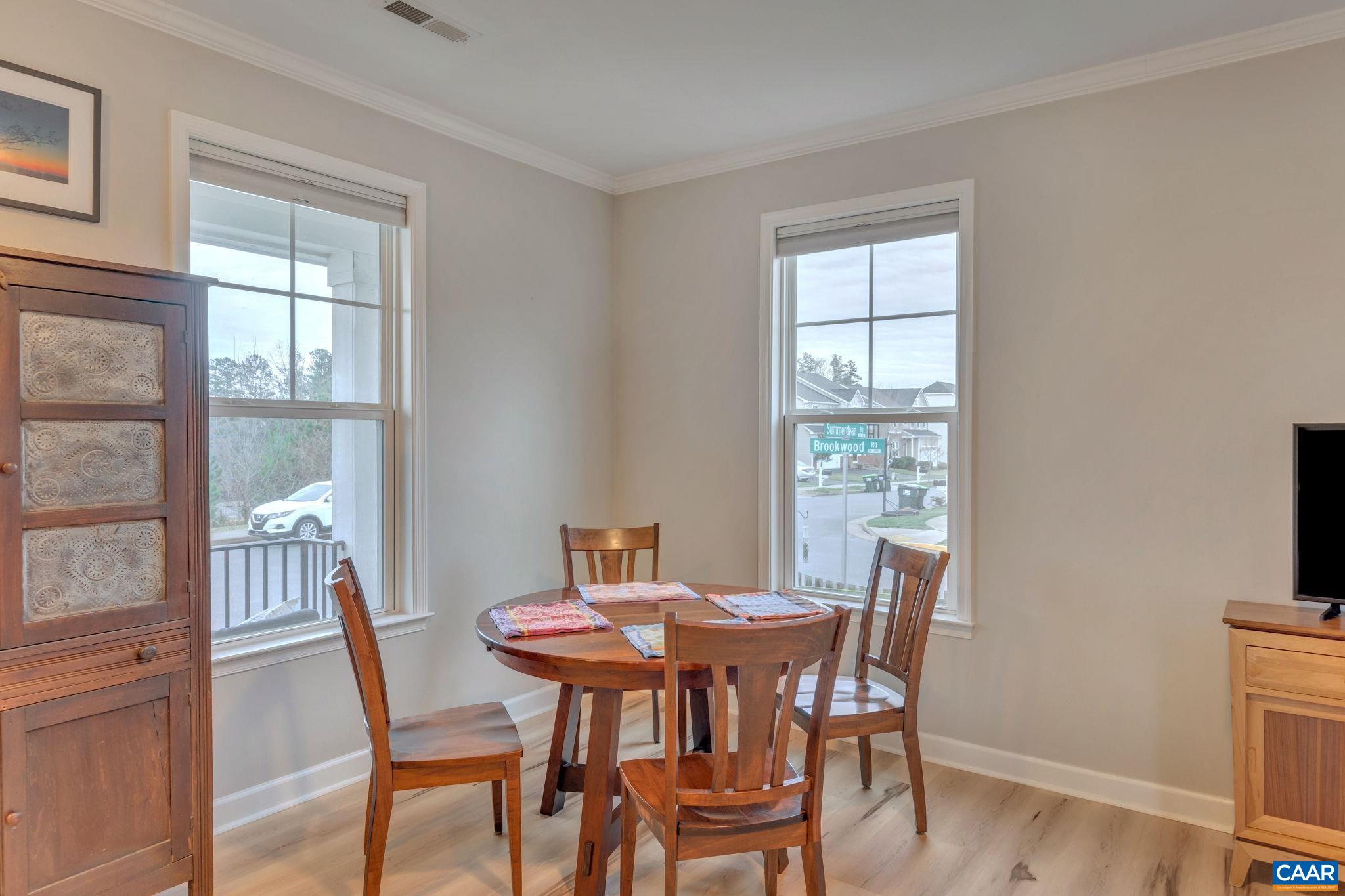 5543 Summerdean Road Crozet, VA 22932 - Photo 12 of 59 a view of a dining room with furniture and wooden floor