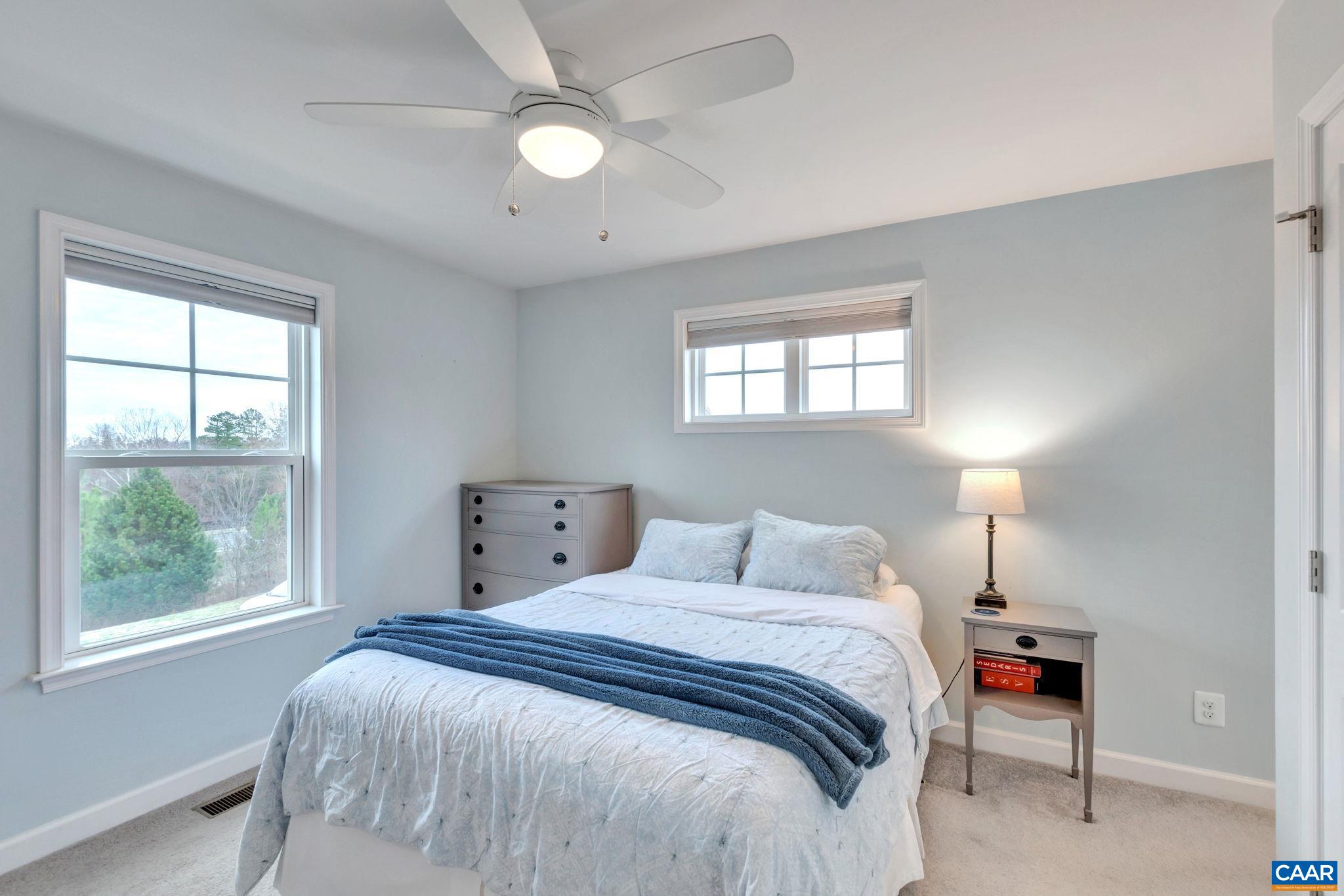 5543 Summerdean Road Crozet, VA 22932 - Photo 16 of 59 a bedroom with a large bed and a window
