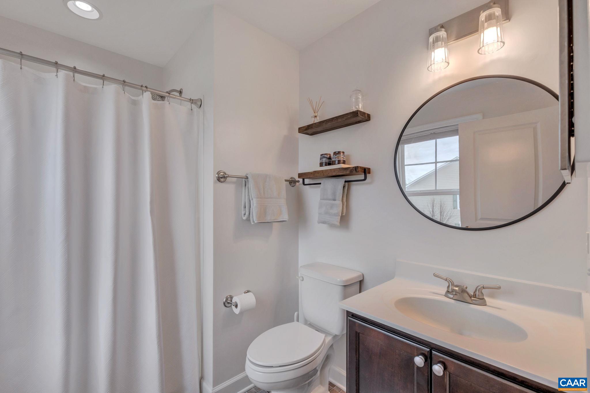 5543 Summerdean Road Crozet, VA 22932 - Photo 19 of 59 a bathroom with a sink toilet and a mirror