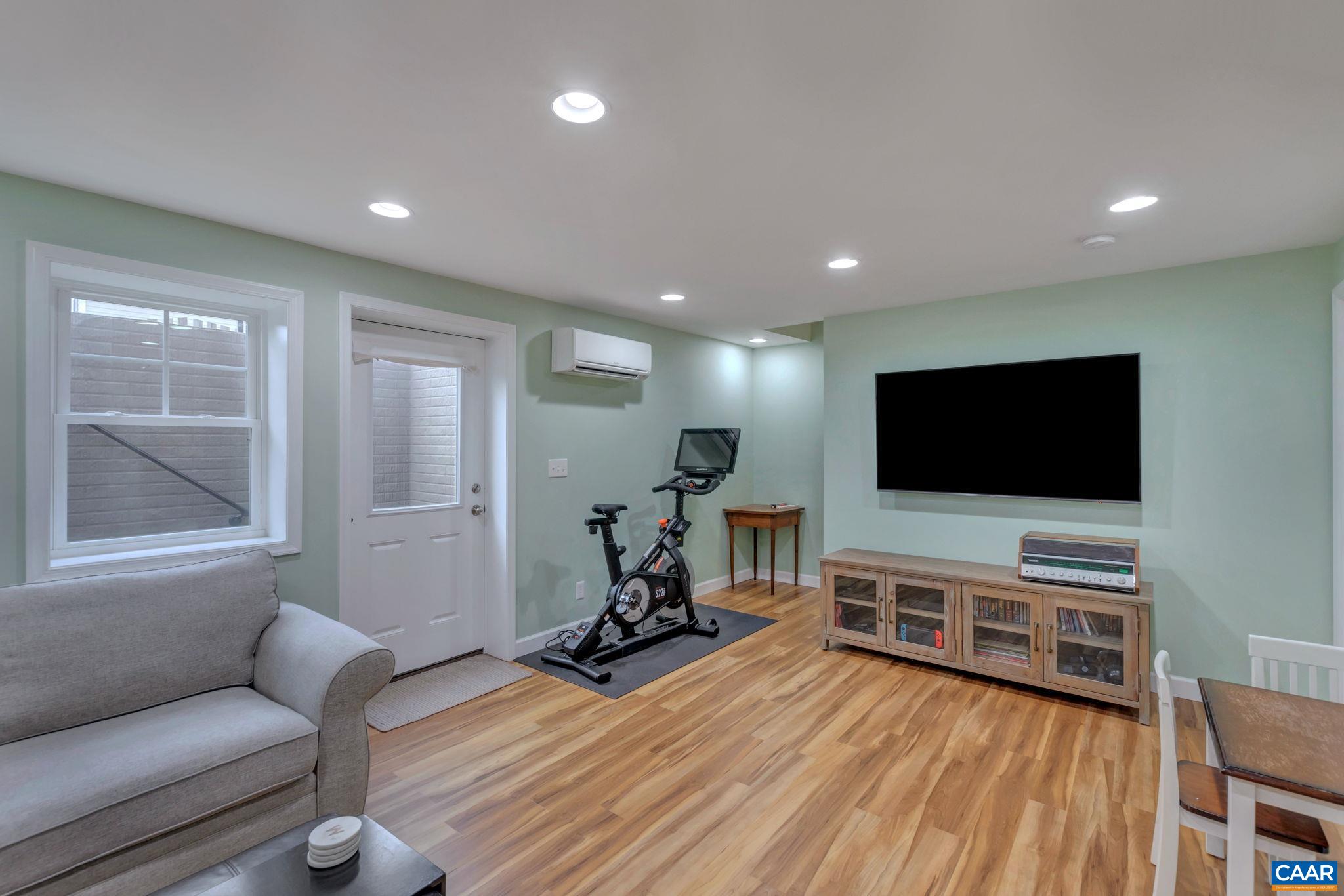 5543 Summerdean Road Crozet, VA 22932 - Photo 25 of 59 a living room with furniture and a flat screen tv