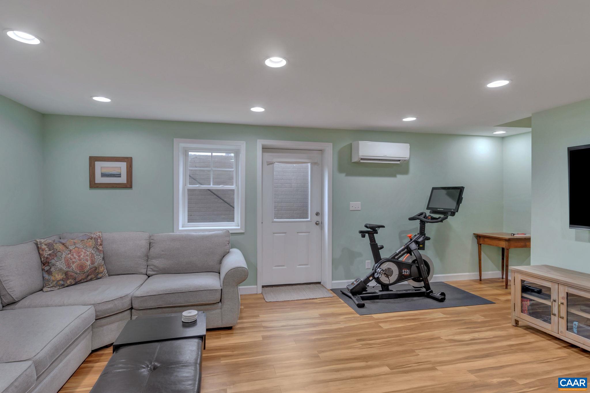 5543 Summerdean Road Crozet, VA 22932 - Photo 26 of 59 a living room with furniture and a flat screen tv